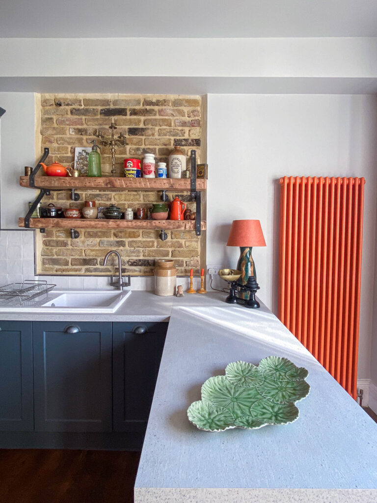Kitchen detail - exposed brickwork on chimney stack over sink